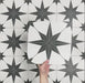 Video showcasing Pole Star Black Moroccan-style 25x25cm patterned porcelain tiles, highlighting the bold black star motif and repeating geometric design.