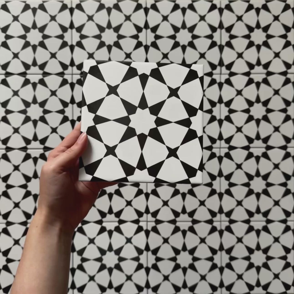 Video showcasing Agraba Black and White Mini 15x15cm Moroccan-style ceramic tiles, highlighting their bold geometric star pattern, matt finish, and detailed craftsmanship in natural lighting.