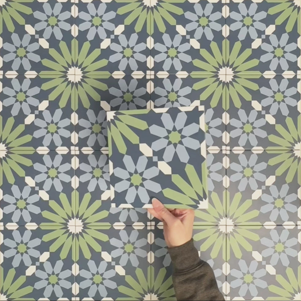 Video showcasing Fizaan Springs Moroccan-style 20×20cm porcelain tiles, highlighting the blue and green geometric star pattern and surface detail.
