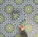 Video showcasing Fizaan Springs Moroccan-style 20×20cm porcelain tiles, highlighting the blue and green geometric star pattern and surface detail.
