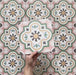 Video showcasing Cabana Paradise 20x20cm Moroccan-style ceramic tiles with a pink, green, and mustard floral pattern, highlighting surface texture and colour detail.
