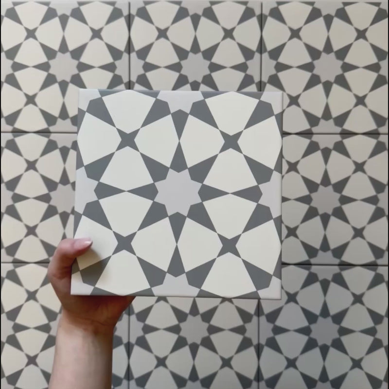 Video showcasing the Agraba Silver 20x20cm Moroccan tile, highlighting its soft grey and white geometric star pattern and matte finish — perfect for modern kitchens, bathrooms, and hallway floors.