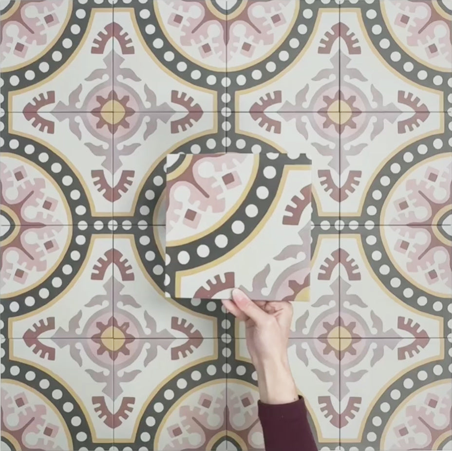 Video showcasing Europa Dortmund 20x20cm Victorian Moroccan style tiles arranged together to showcase the repeating decorative pattern in red, cream, black and mustard tones.