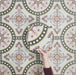 Video showcasing Europa Dortmund 20x20cm Victorian Moroccan style tiles arranged together to showcase the repeating decorative pattern in red, cream, black and mustard tones.