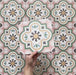 Video showcasing Cabana Paradise 20x20cm Moroccan-style ceramic tiles with a pink, green, and mustard floral pattern, highlighting surface texture and colour detail.