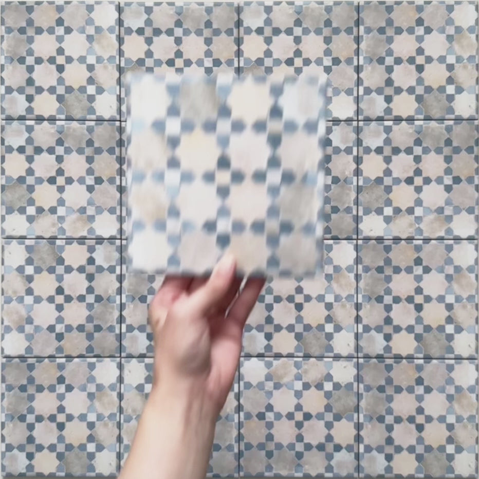 Short video showcasing Bedouin Mequinez Blue Moroccan-style 15x15cm tiles, highlighting the intricate geometric pattern in soft blue, cream, and taupe shades with a hand-painted finish and subtle surface variation.
