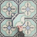 Video showcasing Europa Gothenberg 20x20cm Victorian Moroccan style tiles arranged together to showcase the repeating geometric pattern in blue, mint green and cream tones, displayed against a textured blue background.