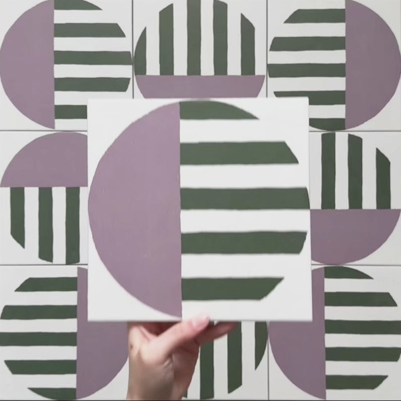 Video showcasing the Geometry Seritina 20x20cm patterned tile, highlighting its green striped and mauve semicircle design on a cream base, and demonstrating how the pattern connects and repeats when multiple tiles are laid together.