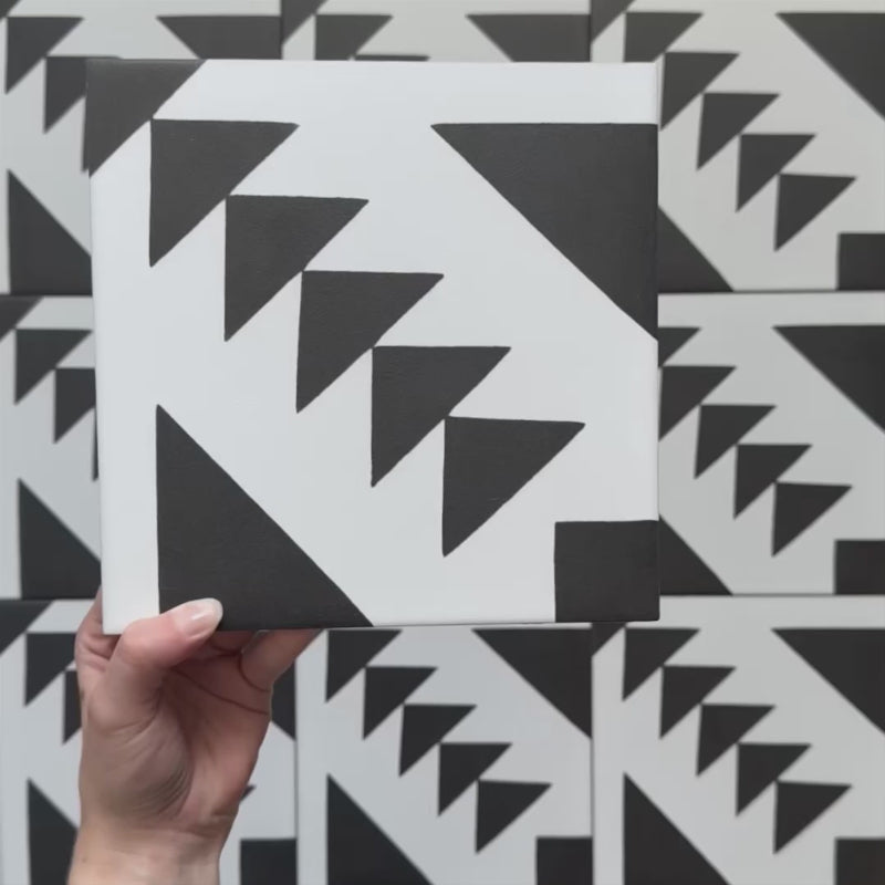 Video showcasing the Alhambra Alkazar 20x20cm Moroccan tiles, highlighting their bold black and white geometric design and matte finish, perfect for statement floors and feature walls.