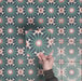 Video showcasing Fizaan Festive Blue Mini 15x15cm Moroccan-style porcelain tiles, highlighting the repeating geometric pattern and rich blue and green tones in close-up detail.