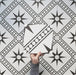 Galata White Moroccan style 20x20cm patterned tiles, shown in a video to highlight the black and white geometric star design in a real-life setting.