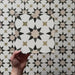 Video showcasing the Agraba Natural 20x20cm Moroccan tile, featuring a beige, olive, and taupe star pattern on a white background with a matte finish, perfect for creating timeless geometric interiors.