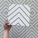 Video showcasing Alhambra Zig Zag Blanco 20x20cm Moroccan tiles, featuring a striking black and white chevron pattern with a modern geometric design ideal for contemporary interiors.
