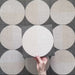Kasuf Night 20x20cm terrazzo-style decor tiles featuring a bold monochrome circular pattern with speckled terrazzo detailing, ideal for creating statement floors and contemporary geometric interiors.