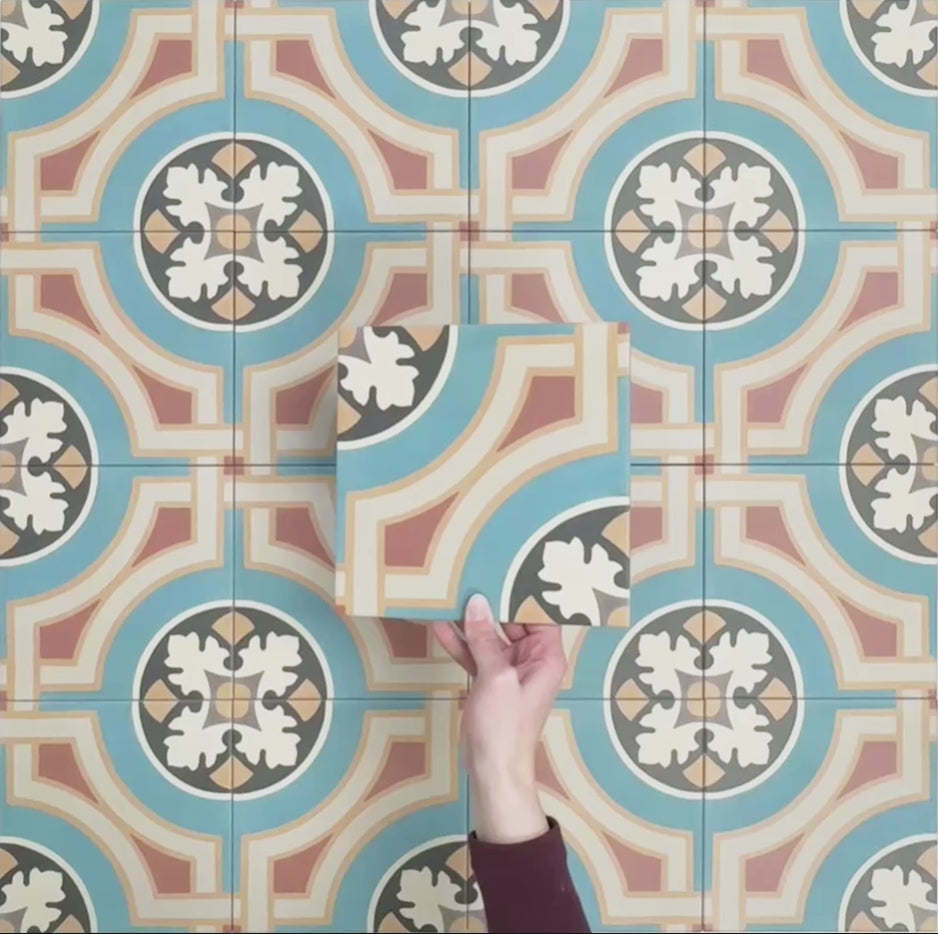 Video showcasing Europa Helsinki 20x20cm Victorian Moroccan style tiles arranged together to showcase the repeating geometric pattern in teal, terracotta, cream and black tones.