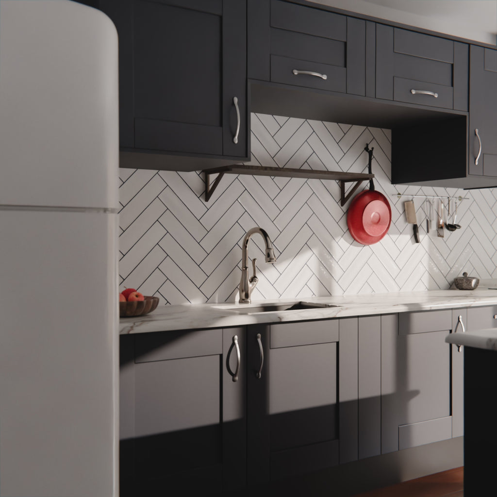 Video showing Durban gloss white handmade-effect tiles in a herringbone kitchen splashback, with light reflecting across the textured surface alongside dark units and marble worktops.