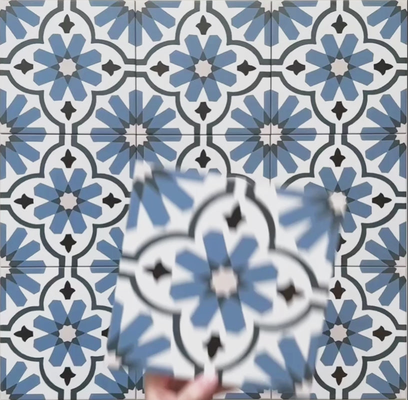 Video showcasing Clarence House Azul Blue 20x20cm Victorian Moroccan-style porcelain tiles, highlighting the intricate blue and white geometric floral pattern and smooth matte finish under natural light.