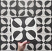 Video showcasing the Geometry Illusion Noir 20x20cm geometric patterned tile, highlighting its bold black and cream semicircle design and demonstrating how the pattern forms a striking repeat when multiple tiles are laid together.