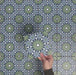 Video showcasing Fizaan Springs Mini Moroccan-style 15×15cm porcelain tiles, highlighting the blue and green geometric star pattern and surface detail.