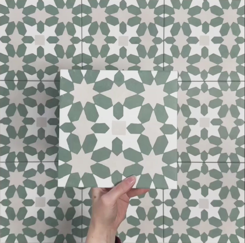 Video showcasing Soukaina Green C Moroccan-style 20cm x 20cm patterned porcelain tiles, highlighting the repeating geometric star design, soft green and neutral colour palette, and matt finish when laid together.