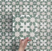 Video showcasing Soukaina Green C Moroccan-style 20cm x 20cm patterned porcelain tiles, highlighting the repeating geometric star design, soft green and neutral colour palette, and matt finish when laid together.