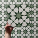 Video of Agraba Green 20x20cm Moroccan-style ceramic tile showcasing its geometric star pattern in layered green and white shades, highlighting the intricate design and smooth matt surface finish.