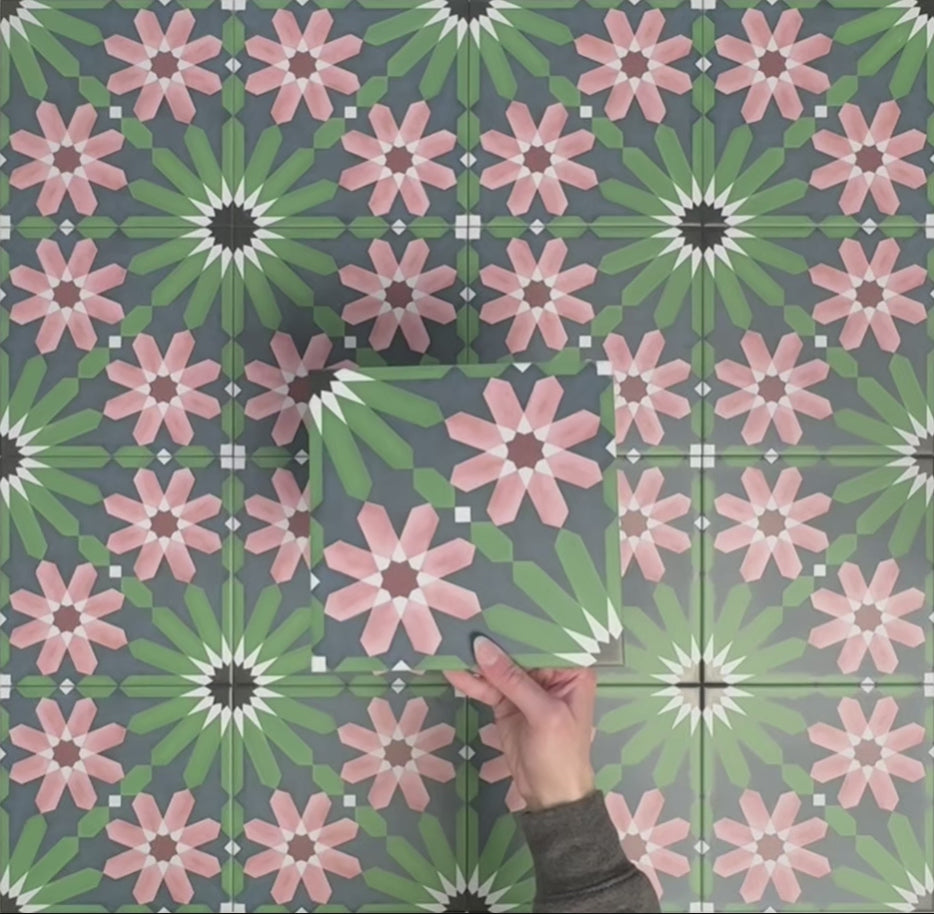 Video showcasing Fizaan Autumn Moroccan-style 20×20cm porcelain tiles, highlighting the dark blue, green and pink geometric floral pattern and surface detail.