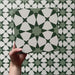 Rotating video of Agraba Green 20x20cm Moroccan-style ceramic tile showcasing its geometric star pattern in layered green and white shades, highlighting the intricate design and smooth matt surface finish.