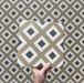 Video showcasing the Carnaby Park Road Victorian-style 20x20cm porcelain wall and floor tiles, featuring close-up views of the repeating olive, white, and black diamond geometric pattern as the camera pans across the tiled surface.