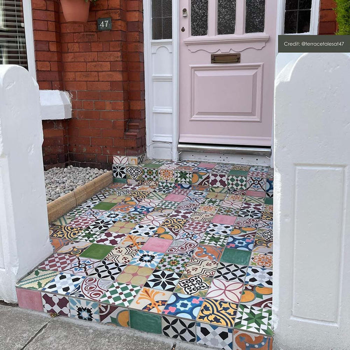 Customer doorstep featuring Fihrdos Mini Patchwork Moroccan-style 15x15cm patterned porcelain floor tiles, creating a colourful mosaic-style entrance with mixed geometric designs.